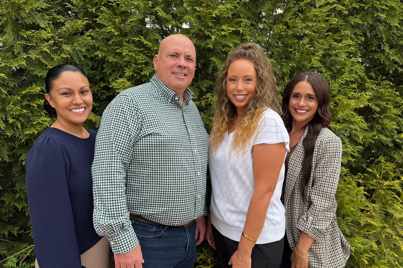 The Mid-Ark Insurance Group team — Michelle Hickman, Mark Hickman, Jennifer Sullivan, and Malissa Wallace — outside the North Little Rock office