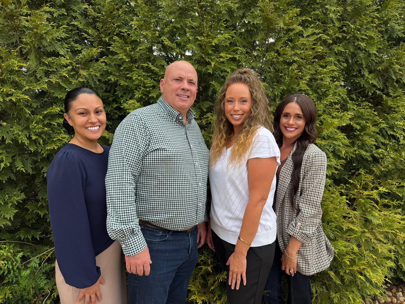 The Mid-Ark Insurance Group team — Michelle Hickman, Mark Hickman, Jennifer Sullivan, and Malissa Wallace — outside the agency's North Little Rock office.